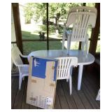 White plastic patio table, 4 stacking chairs
