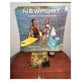 Lot - Vintage Newport Cigarette Advertisement, Dental Snuff Fan, and Regliss Florent Pate Tin