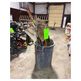 Trash Bin with Shovels, Rake and Tools