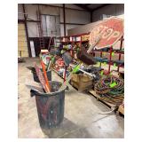 Trash Bin with Brooms and Signs