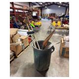 Trash Bin with Brooms and Signs