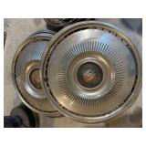 Four 1960s – 70s hubcaps