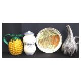 Group of pottery pitcher, lidded jar and plate