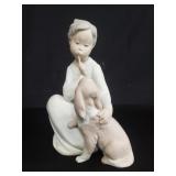 Lladro "Boy with dog" porcelain figurine