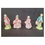 Group of four Royal Doulton porcelain figurines