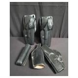 Group of leather and plastic holsters