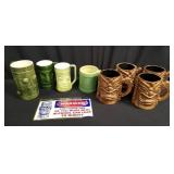 Group of ceramic tiki mugs