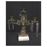 Antique brass candelabra on marble base