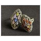 Pair of sterling silver rings with colored glass