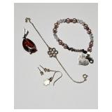 Sterling silver bracelets, earrings, and pendant