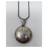 Engraved sterling silver locket pendant on