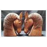 Pair of carved wood horse head sculptures