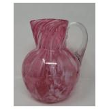 Pink Murano style glass pitcher with swirled