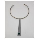 Silver neck ring with metal pendant