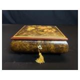 Vintage musical jewelry box with key