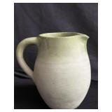 Signed green pottery pitcher