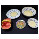 Group of pottery plates, bowls, and basket