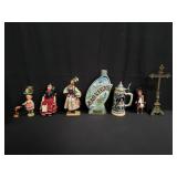 Box of misc dolls, decanter, beer stein and