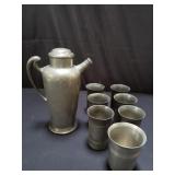 Group of vintage pewter pitcher and cups