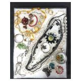Riker display case of costume jewelry,