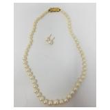 Pearl necklace and pearl earrings