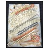 Riker display case of costume jewelry, faux