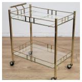 Vintage metal tea cart with glass shelves
