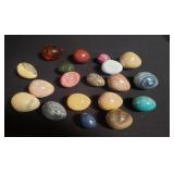 Group of marble, stone and amber eggs