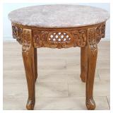 Contemporary carved wood oval side with marble top