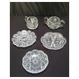 Group of cut crystal creamer and plates