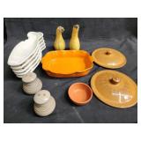 Group of pottery salt and pepper shakes, bowls