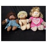 Three Cabbage Patch kid dolls