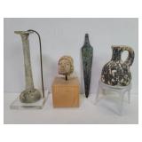 Four antique artifacts.