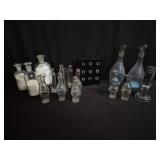 Group of vintage glass decanters and testing tubes