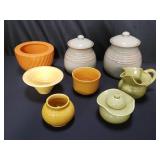 Group of ceramic bowls, lidded jars, cream and