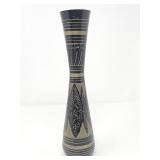 Vintage hand-etched brass vase with a black
