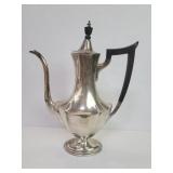 Antique sterling silver coffee pot with an