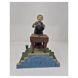 Vintage cast iron magician coin bank