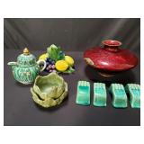 Group of pottery candleholder, creamer, bowls and