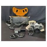 Canon AE-1 camera with accessories and case