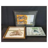 Three framed motorcycle posters
