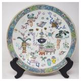 Families Rose antique Chinese charger on a wood