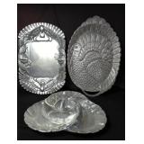 Group of aluminum platters and trays
