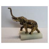 Vintage brass elephant figure on a marble base