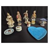 Group of porcelain figurines, plates, and vase