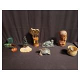 Nude bust, pottery bowl, marble calendar cubes,
