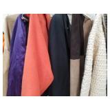 Rack of clothing, coats and skirts