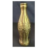 Vintage brass Coca-Cola bottle
