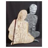 Female and male wood and lead wall decoration