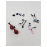 Group of sterling silver earrings with glass